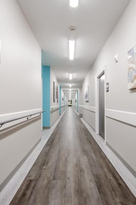 Bright and spacious hallway in a senior care facility