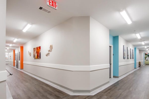 Bright interior hallway in a senior living facility
