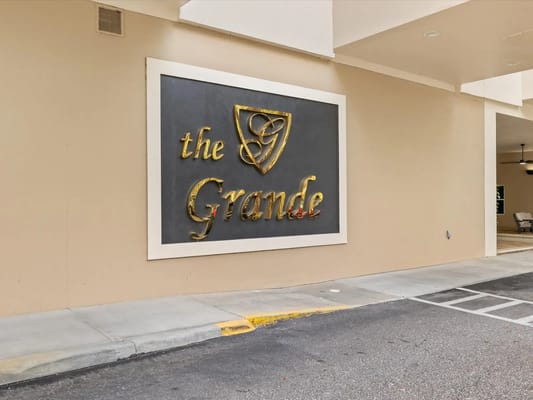 Building sign for The Grande Senior Living