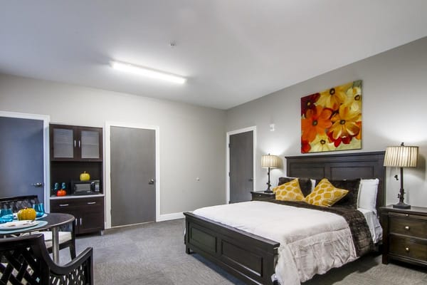 Resident room with a bed and sitting area