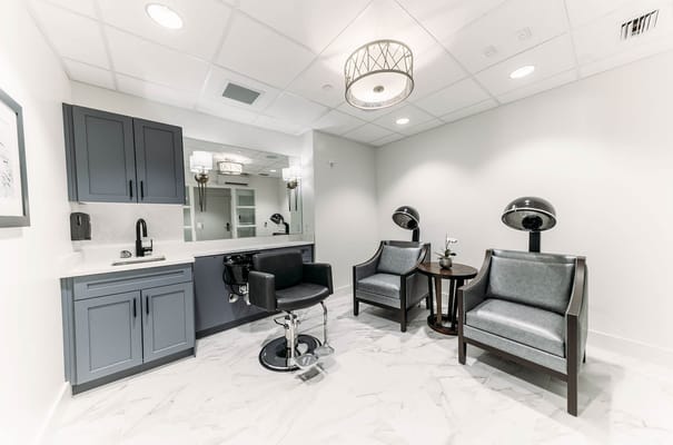 Interior beauty salon area with salon chairs and mirrors