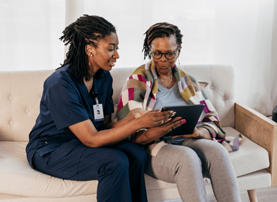 Caregiver and resident sharing information on a tablet