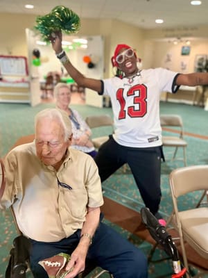 Residents enjoying a festive activity in a common area