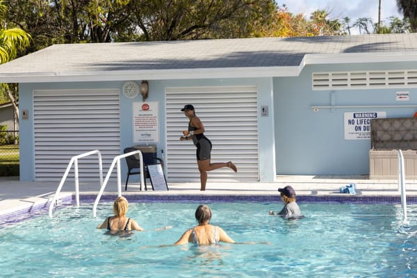 Residents enjoying a swimming pool activity