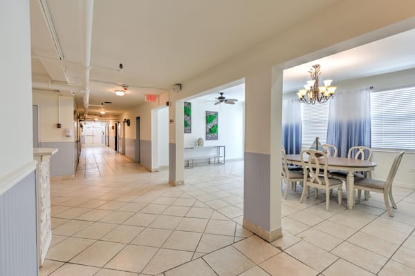 Interior common area with dining table and lounge space