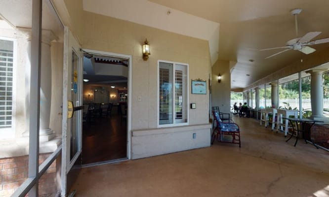 Entrance to the assisted living facility with outdoor seating