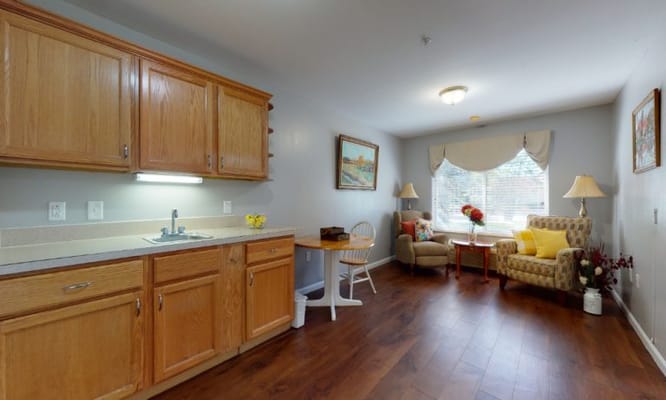 Comfortable interior of a resident room with kitchen area