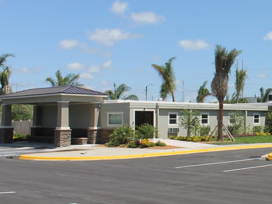 Exterior view of Walton Place facility entrance and landscaping