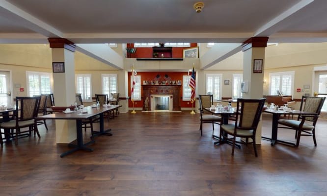 Dining area with table settings and fireplace