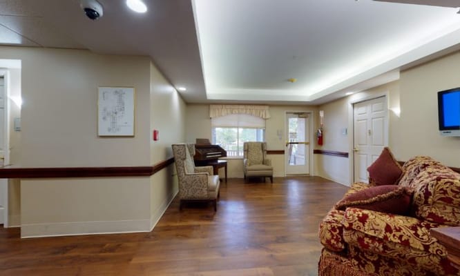 Interior common area with seating and a piano