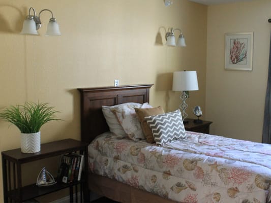 Cozy private resident room with bed and decor