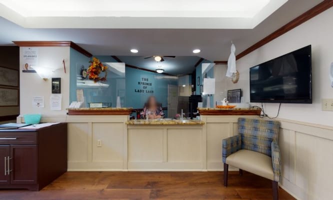 Reception area with staff at the front desk