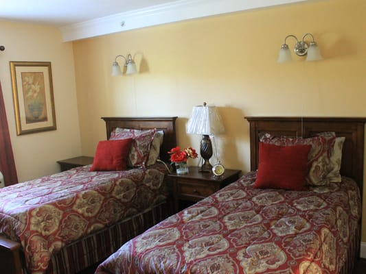 Welcoming interior of a resident room with twin beds