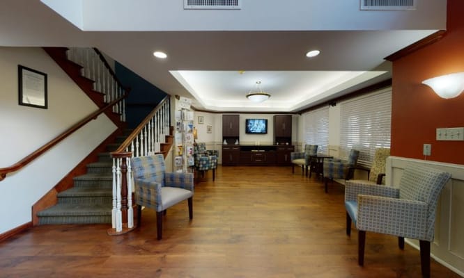 Common area with seating and a staircase