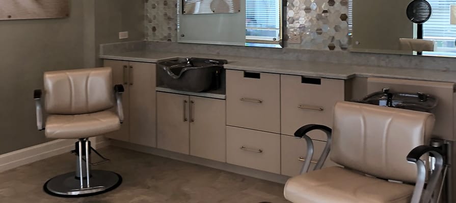 Salon area with styling chairs and mirrors