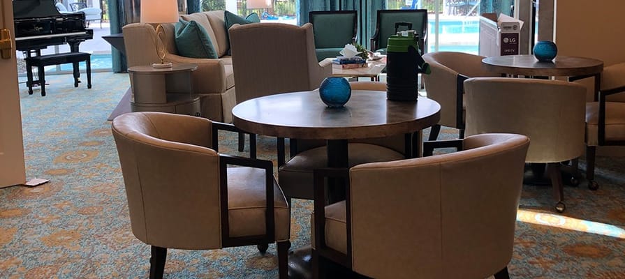 Interior common area with seating and a view of the pool