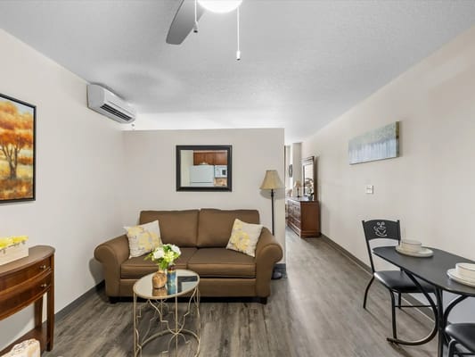 Cozy resident living area with a sofa and dining table