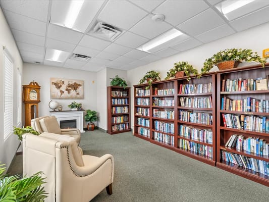 Cozy reading area with bookshelves and seating