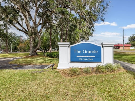 Exterior sign of The Grande Senior Living facility
