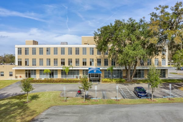 Exterior view of The Grande Senior Living facility