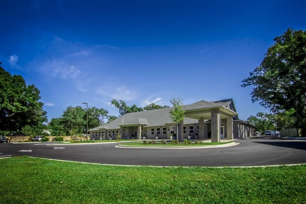 Exterior view of Shelton Manor Inc surrounded by landscaping