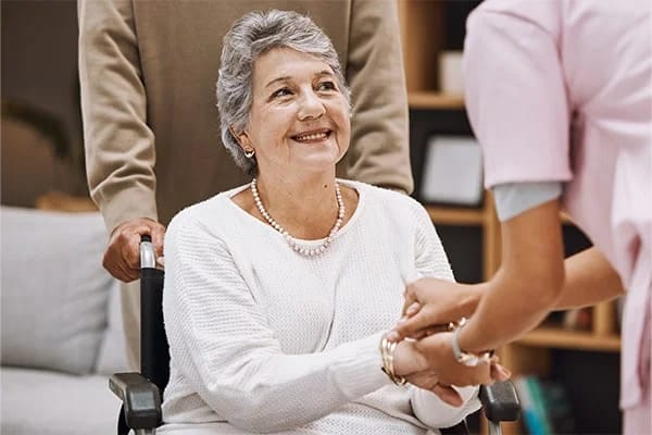 Caregiver interacting with a resident in a warm setting