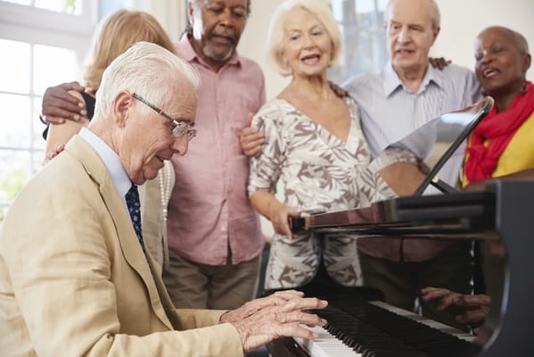 Residents enjoying music together in an activity room