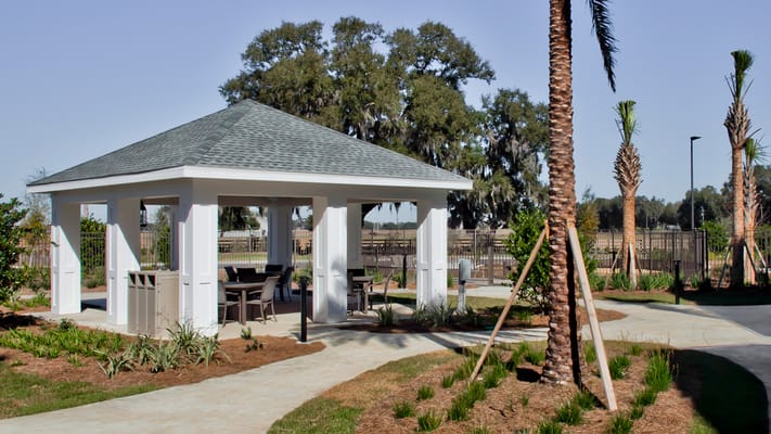 Outdoor patio area with gazebo and landscaping