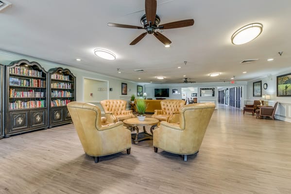 Common area seating with bookshelves in the background