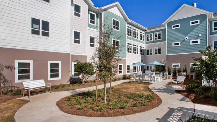 Outdoor courtyard with seating and landscaping