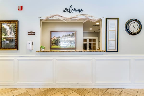 Welcome area with reception desk and decor
