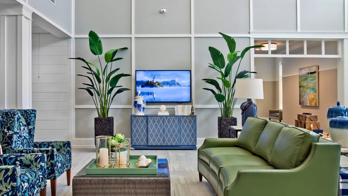 A brightly decorated common area with seating