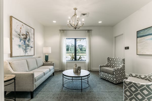 Bright interior common area with seating and artwork