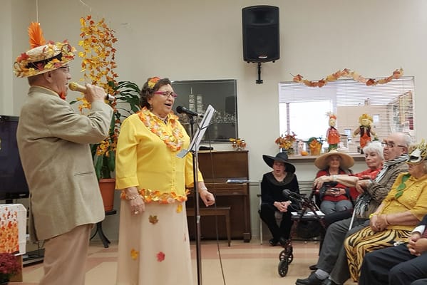 Residents participating in a lively activity indoors