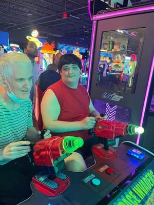 Residents enjoying a gaming activity at an arcade