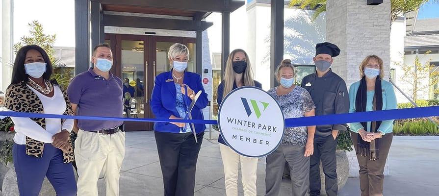 Ribbon-cutting ceremony with staff and members