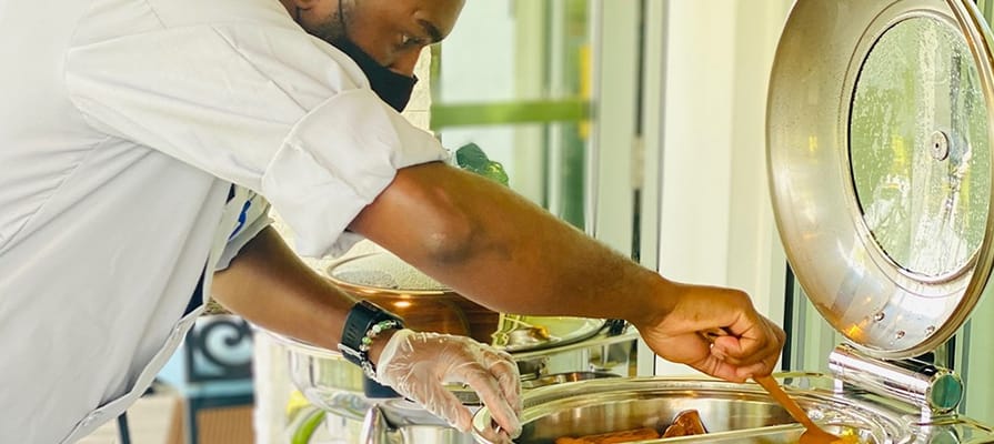 Staff serving food in a dining area