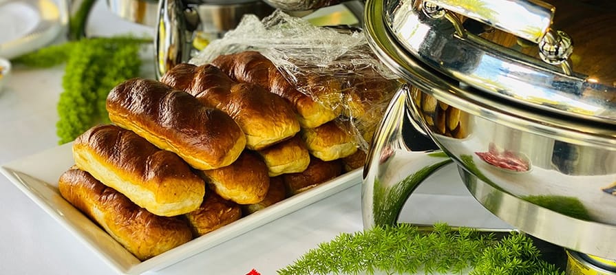 Freshly baked rolls displayed at a dining event