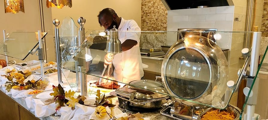 Chef preparing food in the dining area