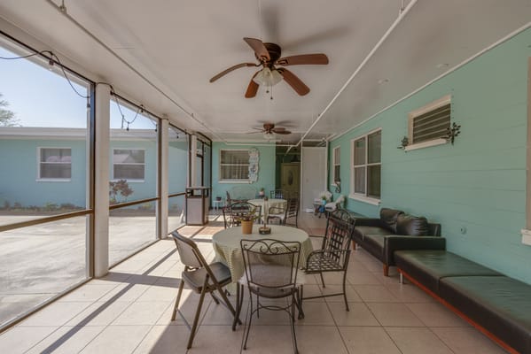 Covered seating area with tables and chairs