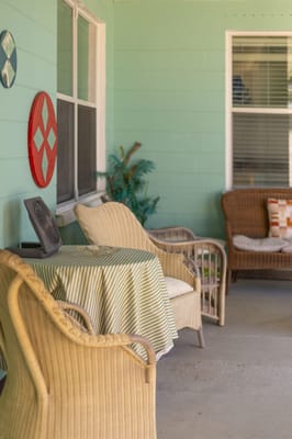 Outdoor seating area with wicker chairs and table
