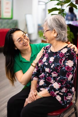 Staff member interacting with a resident in a common area