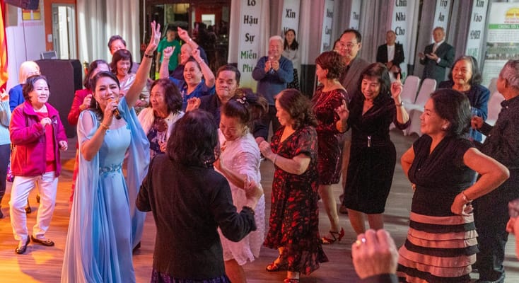 Residents enjoying a lively dance event in a common area
