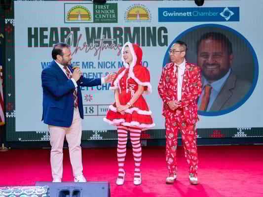 Participants at a Christmas event with festive decorations