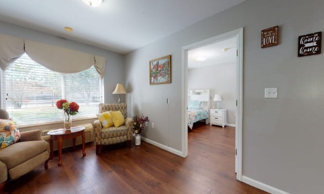 Cozy resident room with furnishings and natural light