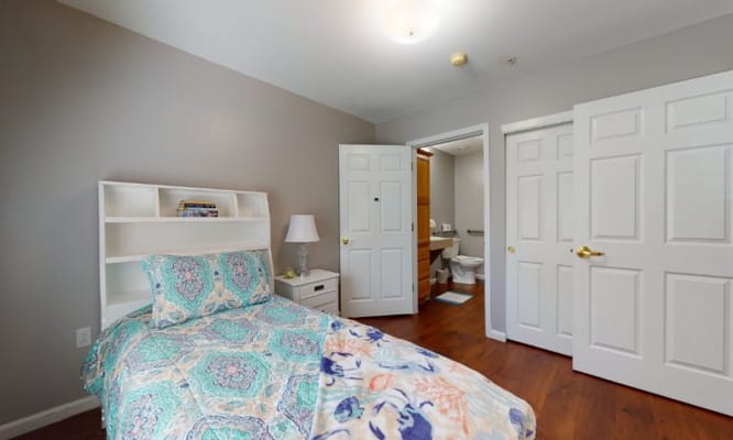 Private resident bedroom with bathroom access