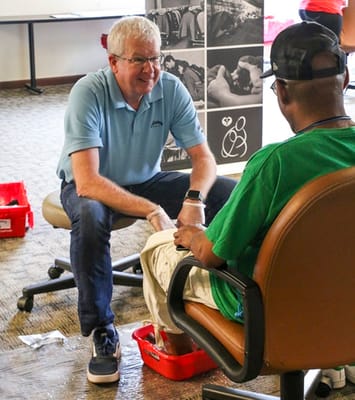Volunteer assisting a resident with an activity