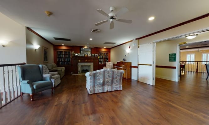 Cozy common area with comfortable seating and bookshelves