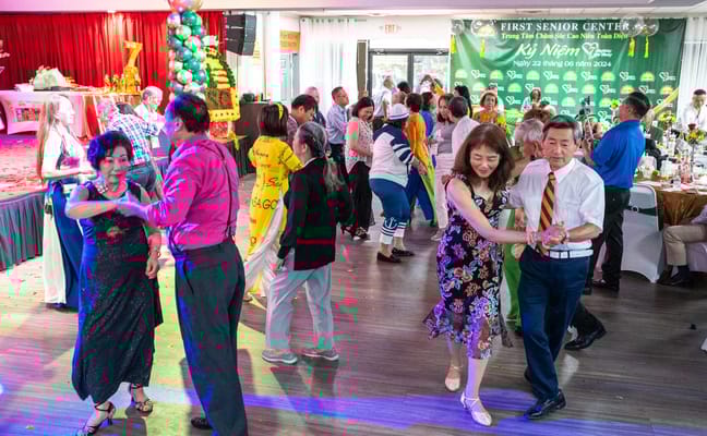 Residents dancing at a social event in the facility