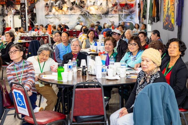 Residents gathered in a common area enjoying an event